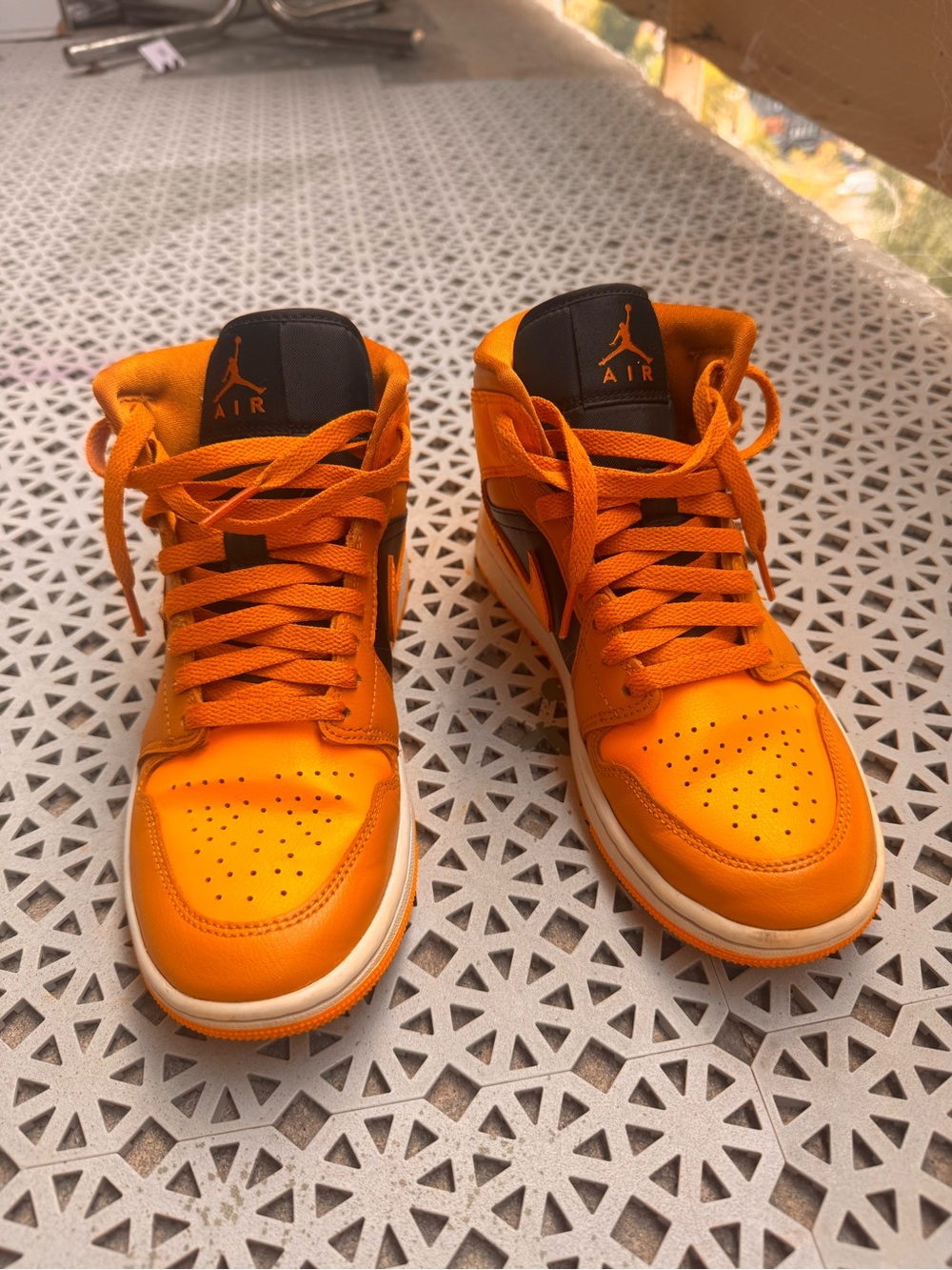 Nike Orange High-Top Sneakers with Black Tongue Detail